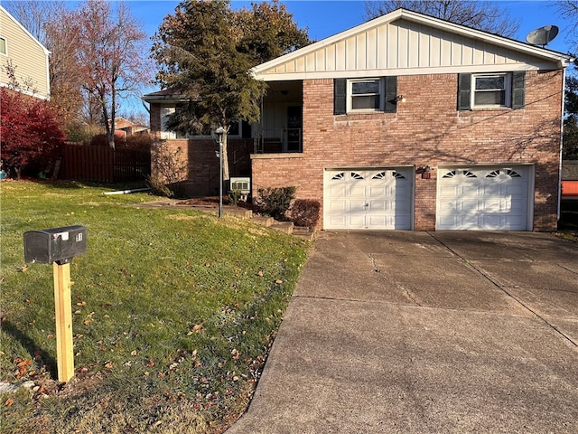 view of front of home with a garage and a front yard