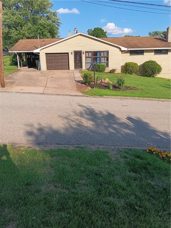 ranch-style house with a front yard and a garage