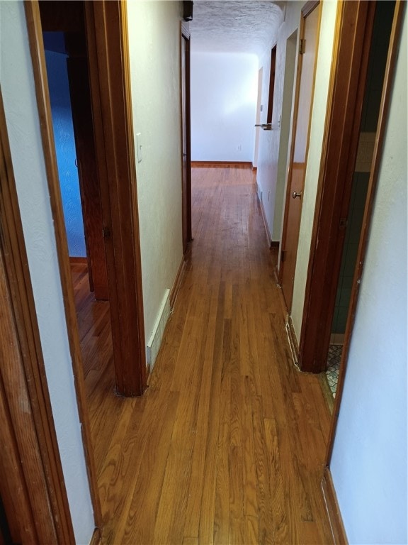 hall featuring hardwood / wood-style flooring