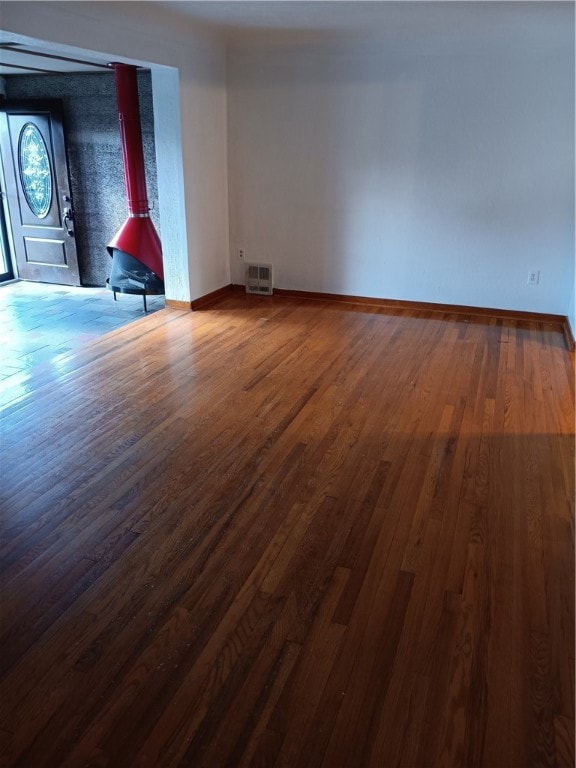 empty room with dark hardwood / wood-style floors