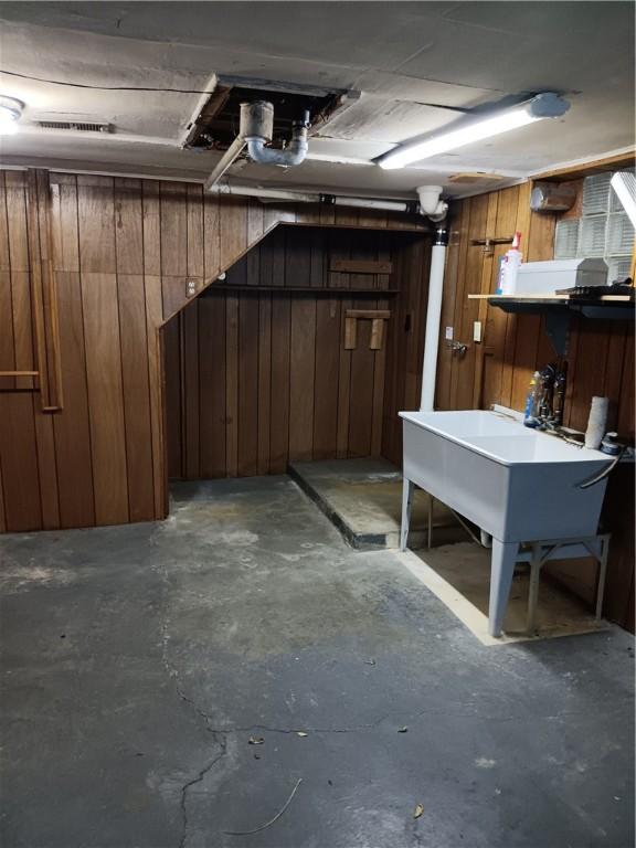 basement with wood walls