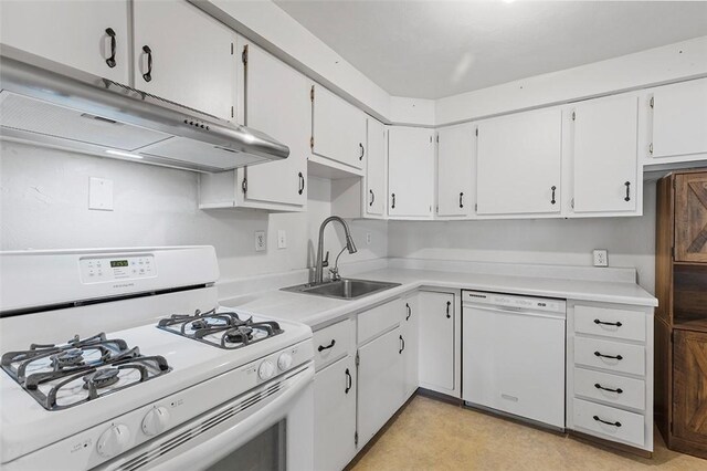 kitchen with sink, white appliances, and white cabinets