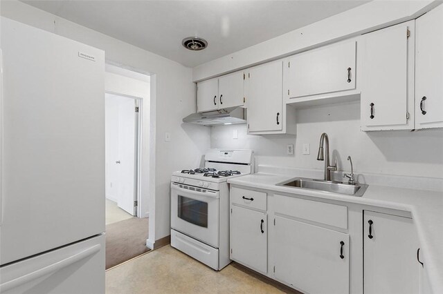 kitchen featuring sink, white cabinets, white appliances, and light colored carpet