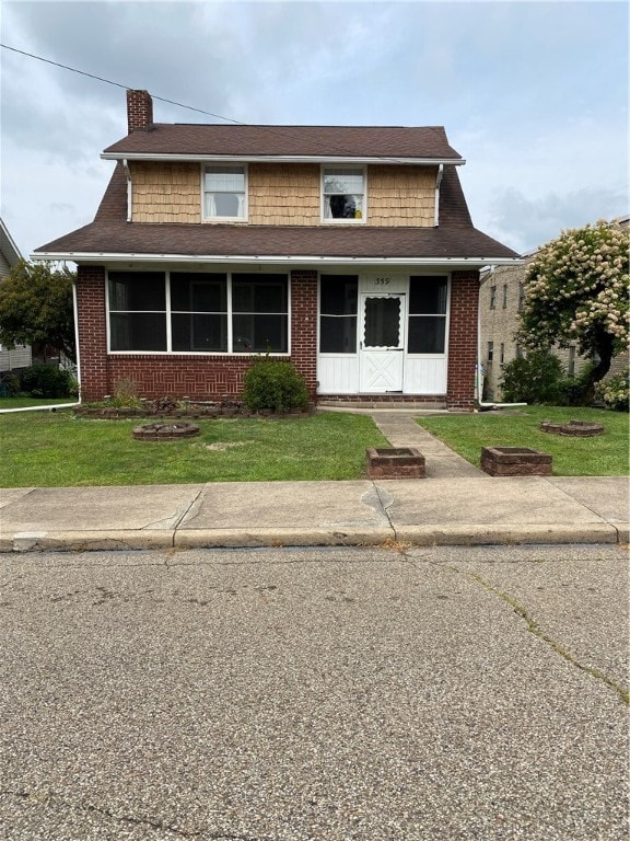 view of front of house with a front lawn