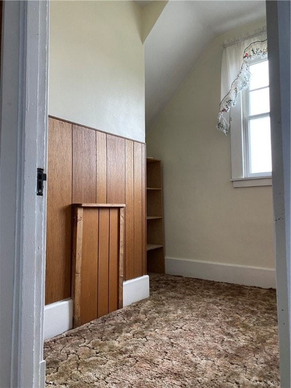 bonus room featuring carpet and lofted ceiling