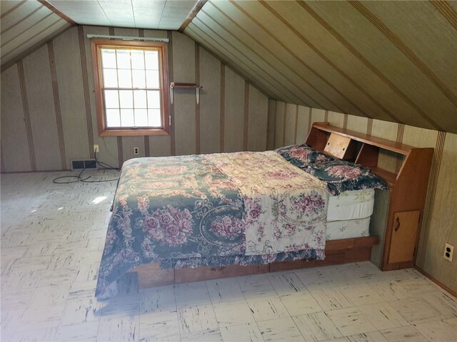 unfurnished bedroom with lofted ceiling