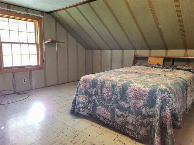 bedroom featuring lofted ceiling