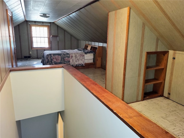 unfurnished bedroom featuring vaulted ceiling