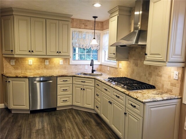 kitchen featuring sink, dark hardwood / wood-style flooring, decorative light fixtures, appliances with stainless steel finishes, and wall chimney exhaust hood