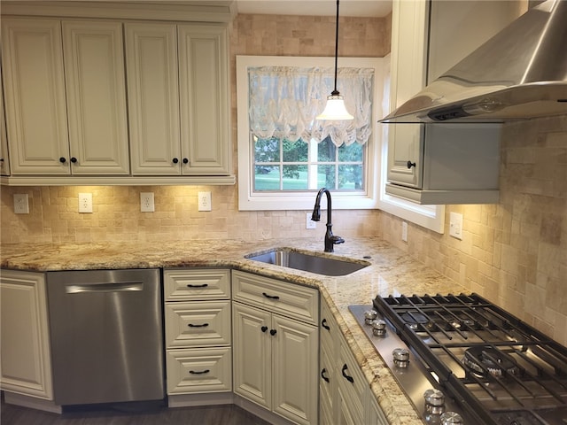 kitchen featuring sink, stainless steel appliances, decorative backsplash, and wall chimney exhaust hood