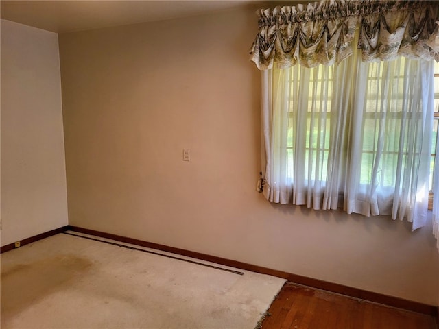 unfurnished room featuring wood-type flooring