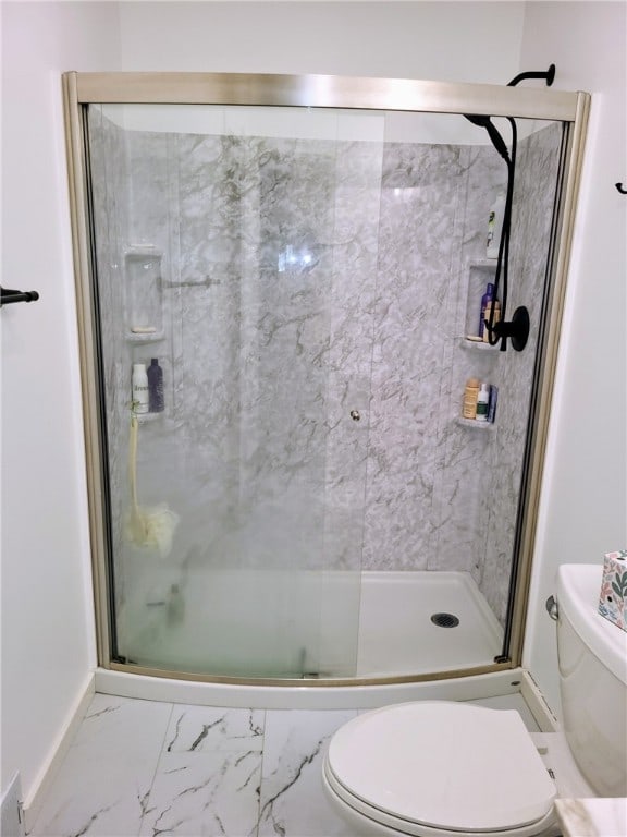 bathroom with tile patterned flooring, an enclosed shower, and toilet