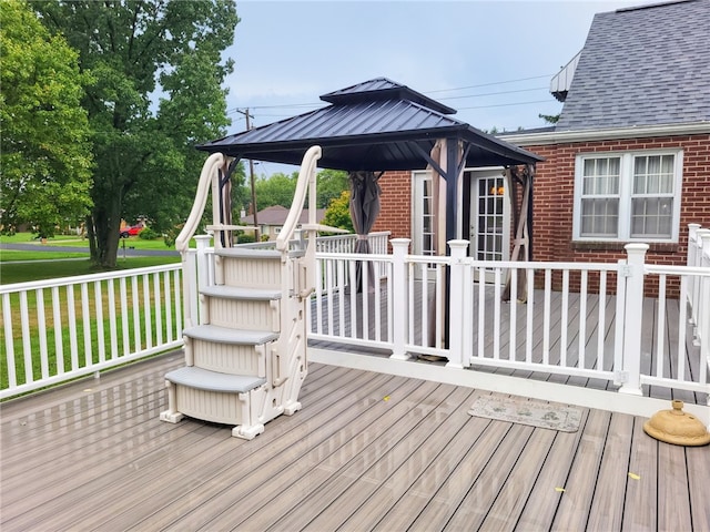 deck with a gazebo and a lawn