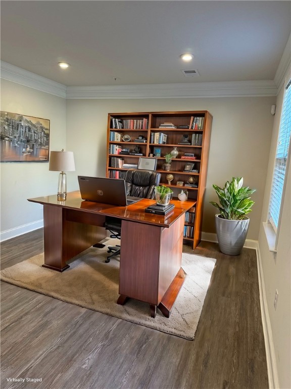 home office with dark wood-type flooring and crown molding