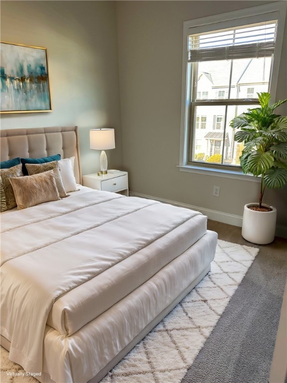 bedroom featuring light colored carpet