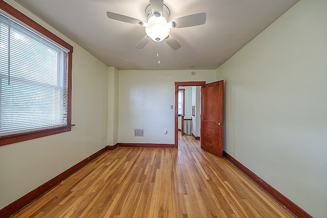 spare room with ceiling fan and light hardwood / wood-style floors