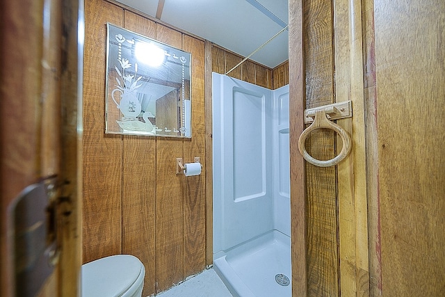 bathroom with a shower and toilet