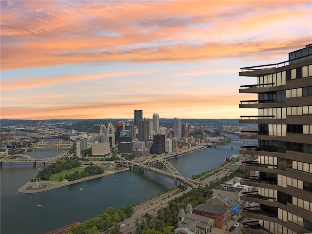 aerial view at dusk with a water view