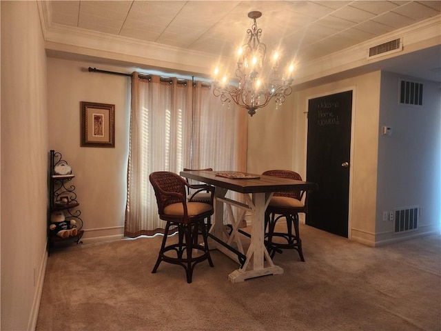 carpeted dining space with an inviting chandelier and ornamental molding