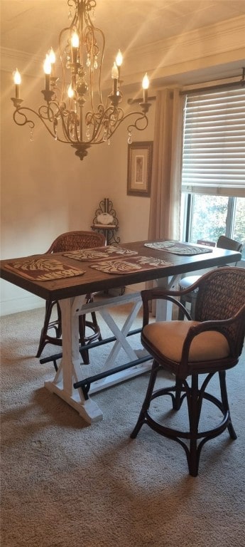 carpeted dining area with ornamental molding