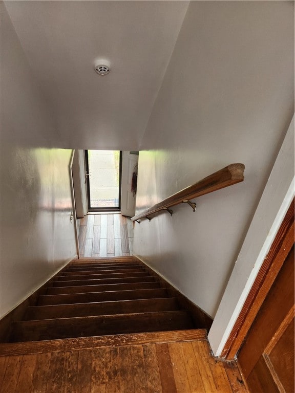 stairway featuring hardwood / wood-style flooring