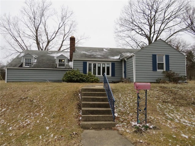 view of front of house featuring a chimney