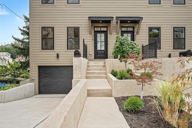 view of exterior entry featuring a garage