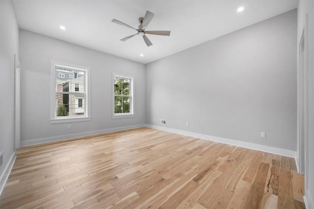 spare room with ceiling fan and light hardwood / wood-style flooring