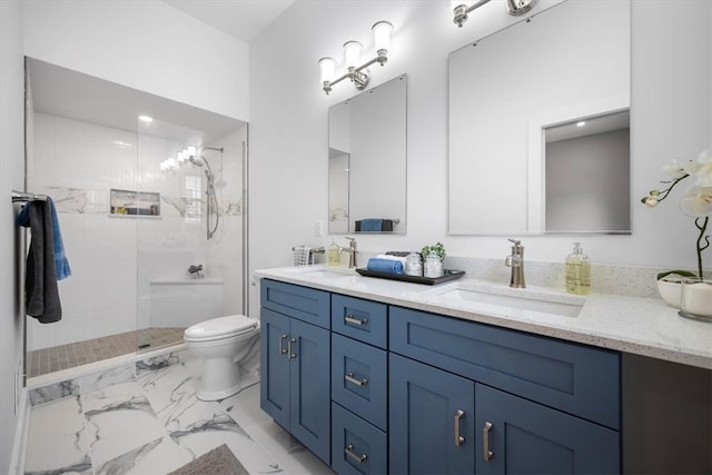 bathroom featuring tile patterned floors, toilet, dual bowl vanity, and a tile shower