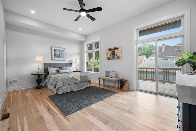 bedroom featuring access to outside, ceiling fan, and light hardwood / wood-style flooring