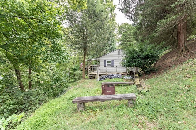 view of yard featuring a wooded view