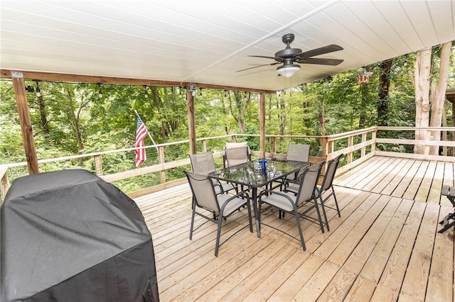 deck featuring ceiling fan, outdoor dining space, and a grill