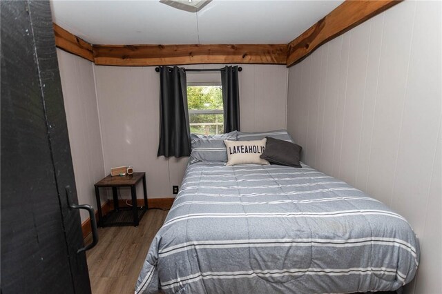 bedroom with wood finished floors