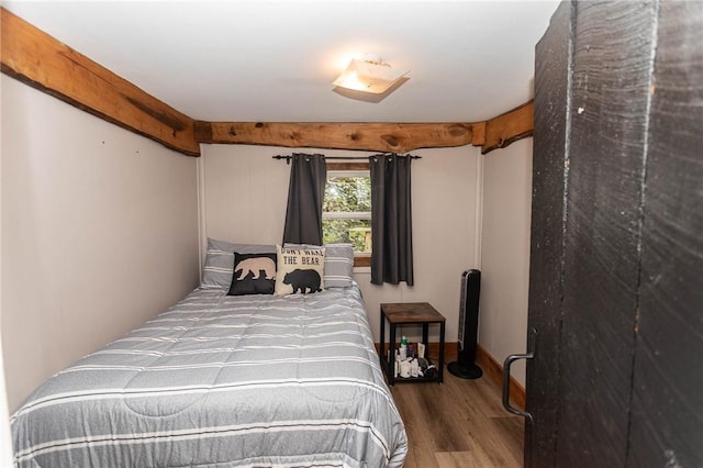 bedroom featuring wood finished floors