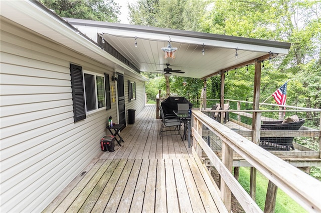 wooden deck featuring ceiling fan