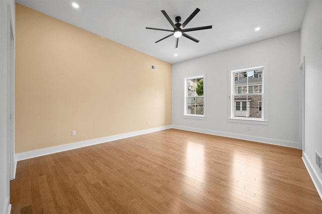 unfurnished room with light wood-type flooring and ceiling fan