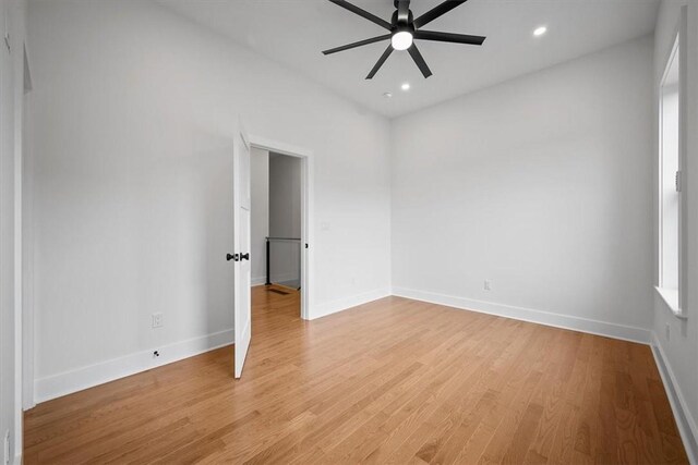 spare room featuring ceiling fan and light wood-type flooring