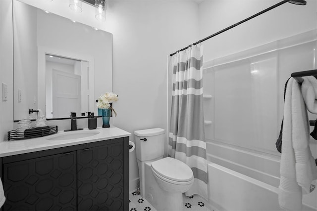 full bathroom featuring tile patterned floors, shower / bath combination with curtain, vanity, and toilet