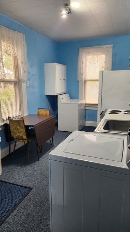 laundry room featuring washer / clothes dryer and carpet