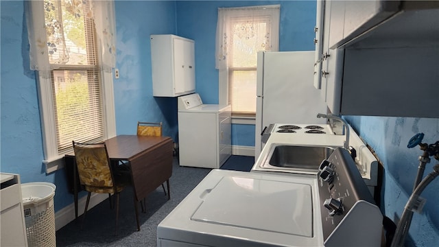 washroom featuring sink and washer / clothes dryer