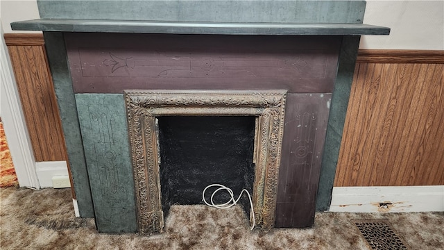 interior details with wood walls and carpet