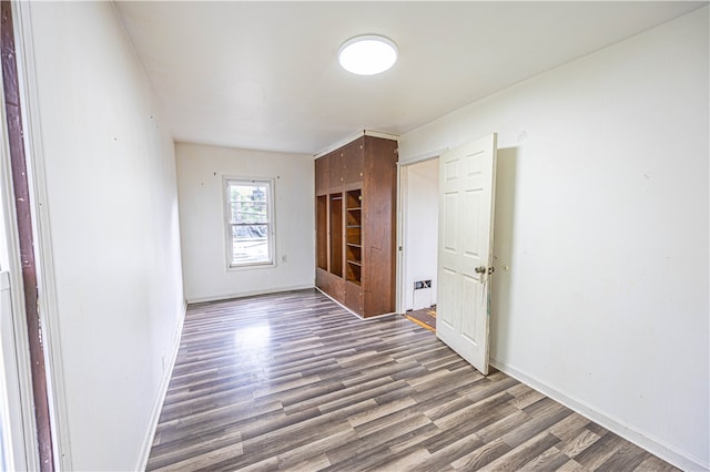 unfurnished bedroom featuring hardwood / wood-style flooring