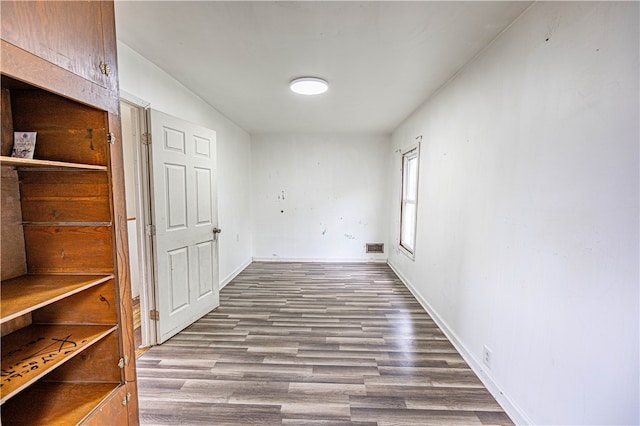 hall with wood-type flooring