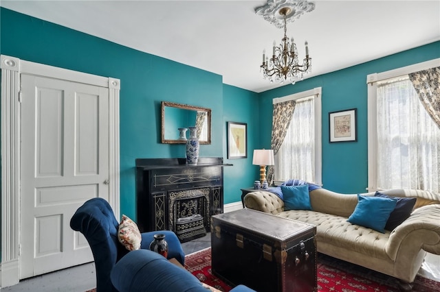 living room featuring a chandelier and a premium fireplace