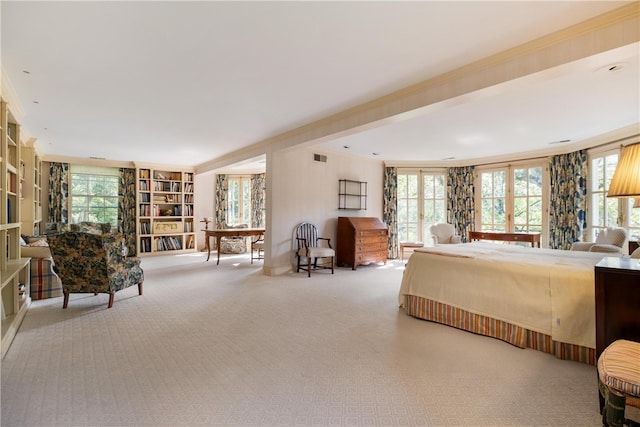 bedroom featuring light carpet