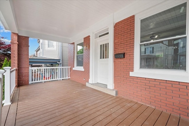 wooden terrace with a porch