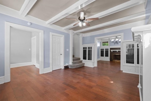 interior space with ceiling fan with notable chandelier, beamed ceiling, and dark hardwood / wood-style floors