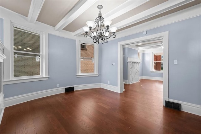 unfurnished dining area featuring dark wood-type flooring, beamed ceiling, and a chandelier