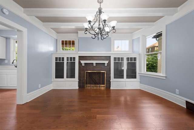 unfurnished living room with beam ceiling, wood-type flooring, and a notable chandelier