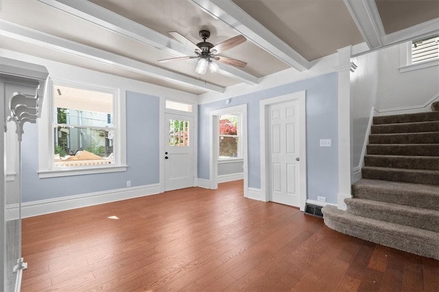 foyer with ceiling fan, hardwood / wood-style flooring, and beamed ceiling